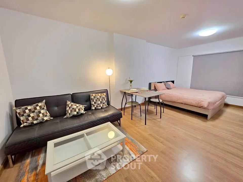 Modern studio apartment with cozy living area and stylish decor