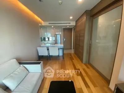 Modern living room with wooden flooring and glass partition in luxury apartment
