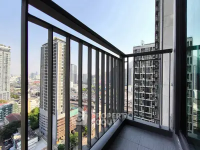 Modern urban balcony with stunning cityscape view from high-rise building.