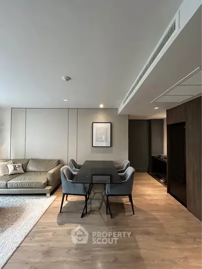 Modern living room with elegant dining area and stylish furniture