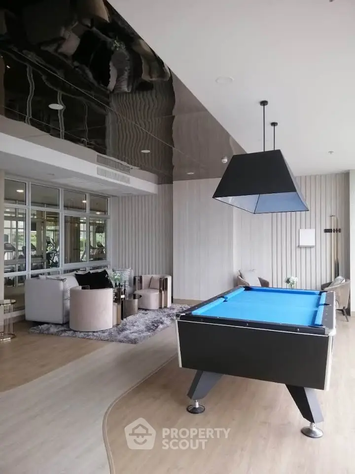 Luxurious modern living room with pool table and stylish decor