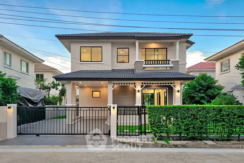 Stunning modern two-story house with lush garden and sleek design in a serene neighborhood.