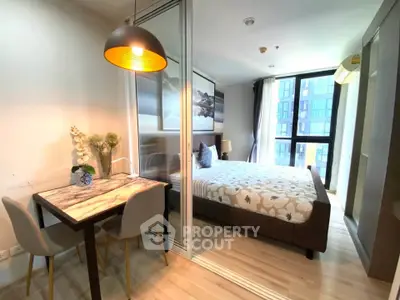Modern bedroom with stylish decor and natural light in a contemporary apartment.