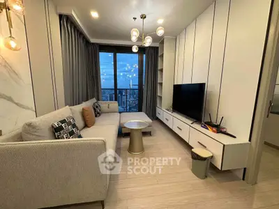 Modern living room with city view, stylish decor, and elegant lighting.