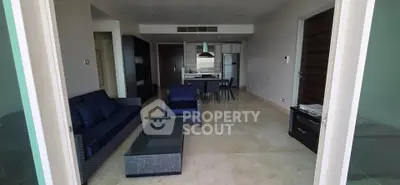 Spacious modern living room with open kitchen and stylish furniture