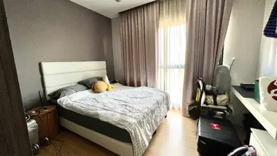 Cozy bedroom with modern decor and ample natural light
