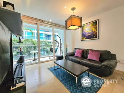 Modern living room with balcony view, stylish furniture, and natural light in urban apartment.