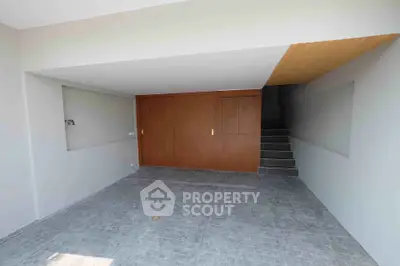 Spacious modern garage with sleek wooden accents and tiled flooring