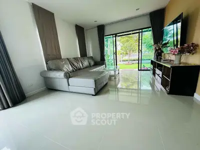 Spacious living room with modern sofa and garden view