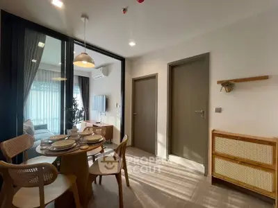 Modern dining area with stylish furniture and natural light in a contemporary apartment.