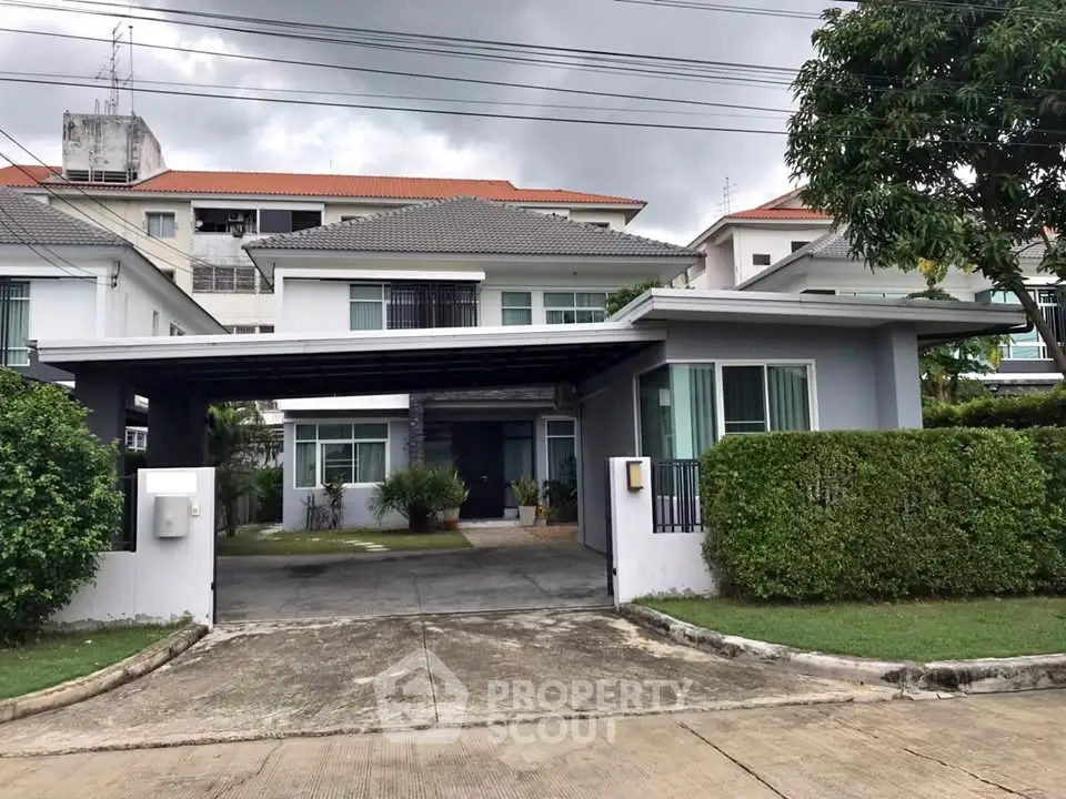 Charming suburban house with modern design and lush greenery