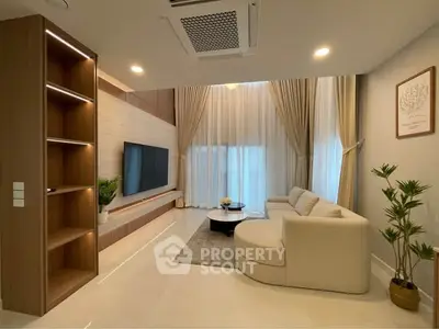 Luxurious modern living room with elegant decor and ample natural light