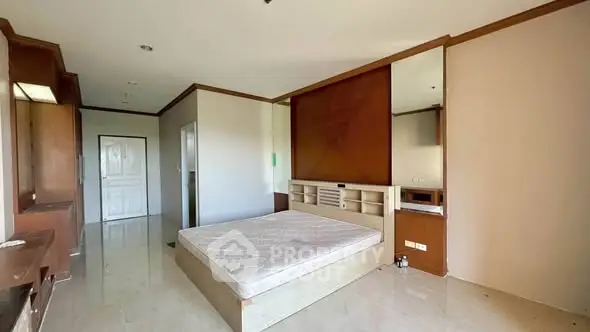 Spacious bedroom with modern design and ample natural light