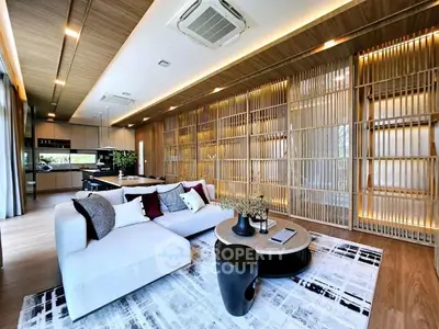 Luxurious open-layout living room with modern decor and wooden accents