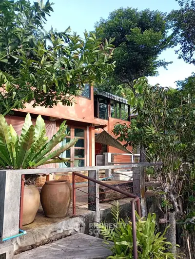 Charming rustic home surrounded by lush greenery and natural beauty