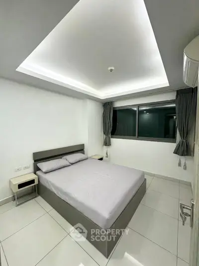 Modern minimalist bedroom with sleek design and ambient lighting