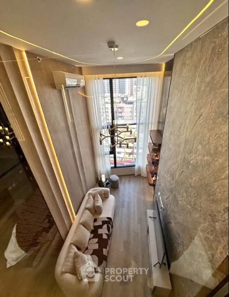 Luxurious high-ceiling living room with modern decor and city view, perfect for urban living.