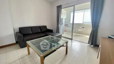 Modern living room with glass coffee table and balcony view