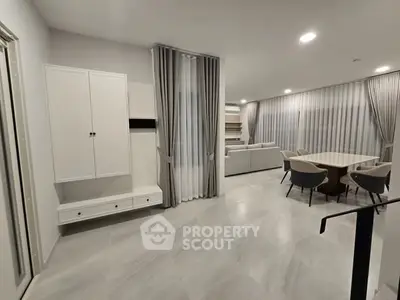 Spacious modern living room with elegant dining area and stylish decor