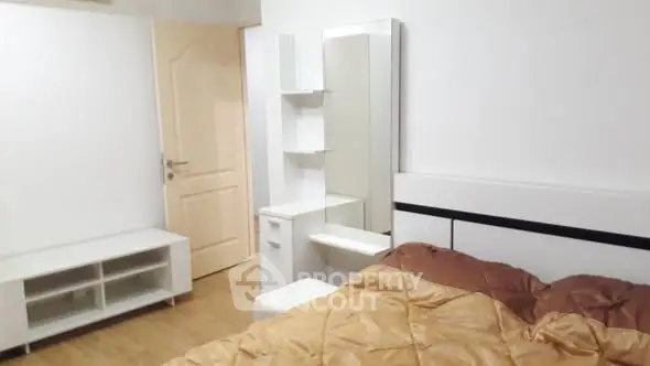 Modern bedroom with stylish furniture and cozy bedding