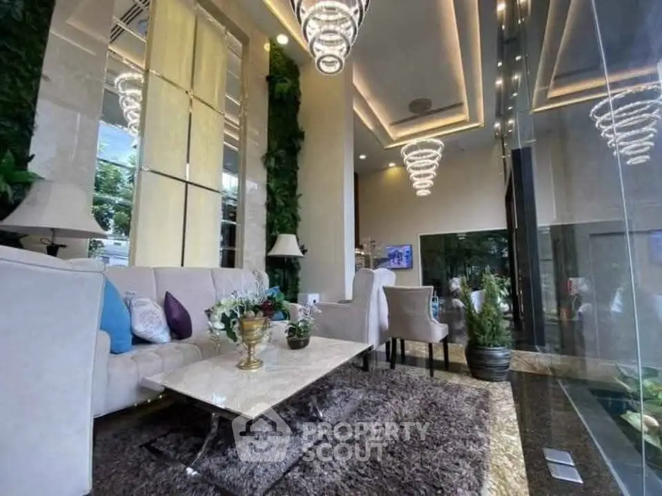 Luxurious modern living room with elegant lighting and plush furnishings in a high-end apartment.