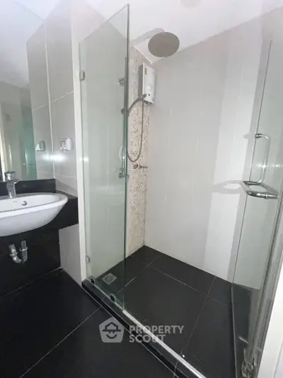Modern bathroom with sleek glass shower and contemporary fixtures