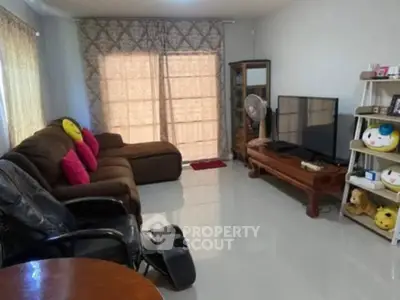 Cozy living room with plush sofas and entertainment center