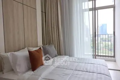 Modern bedroom with city view and stylish decor in a high-rise apartment.