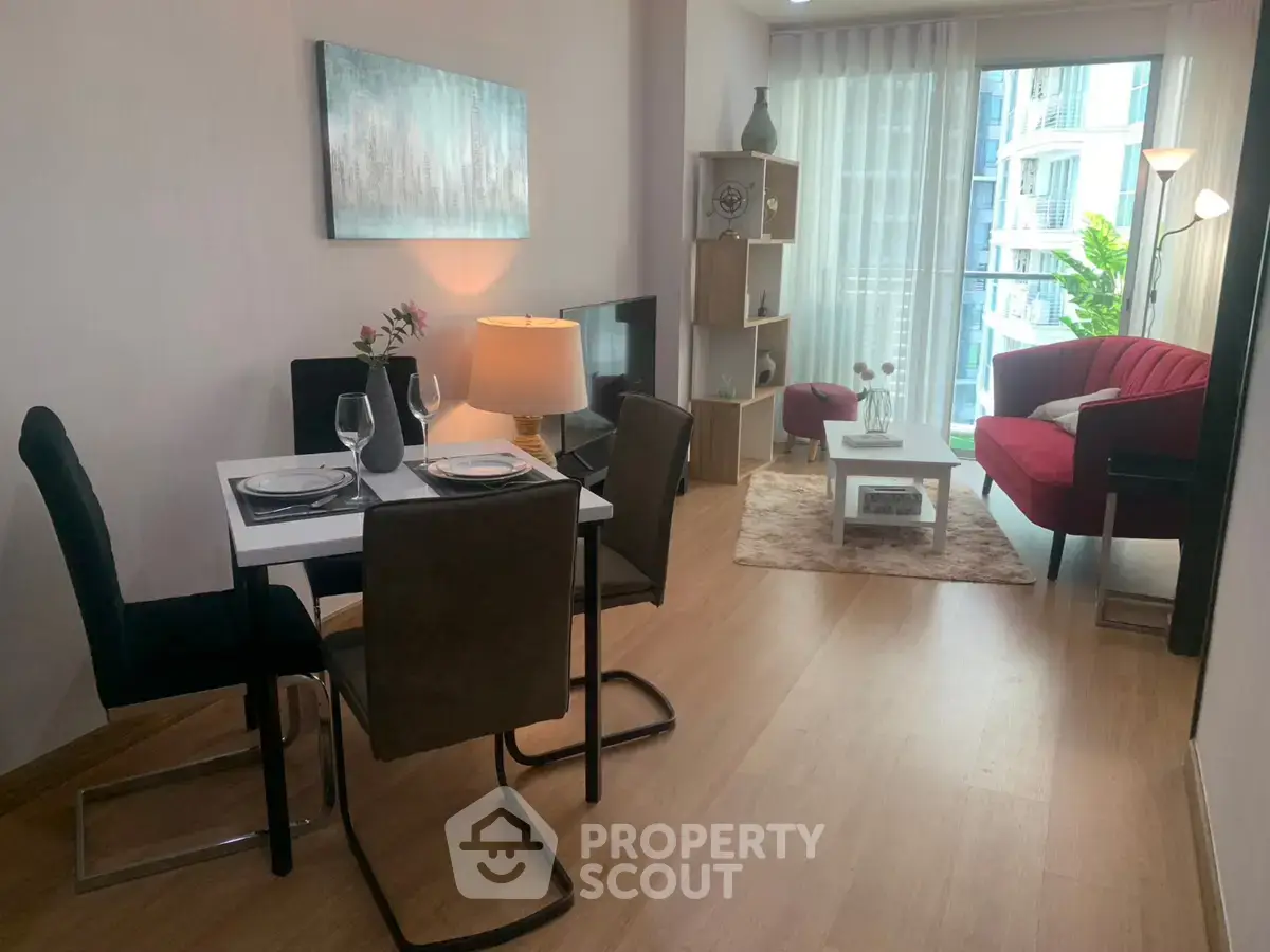 Modern living room with dining area and balcony view in stylish apartment