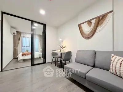 Modern living room with stylish decor and cozy bedroom view