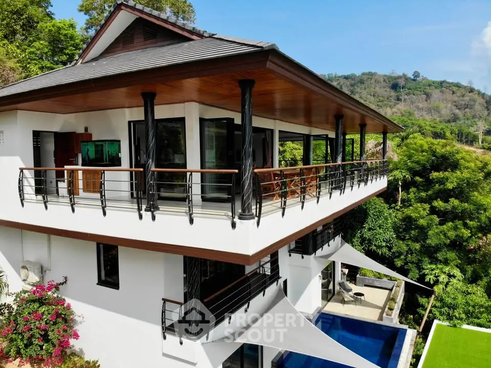 Stunning modern villa with expansive balcony and lush greenery views