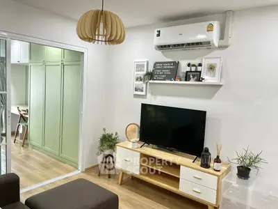 Chic living room with modern decor and air conditioning, perfect for cozy relaxation.