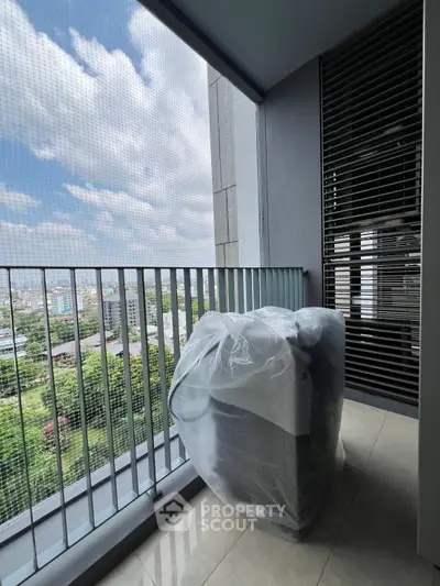 Spacious balcony with city view, perfect for relaxation and enjoying the skyline.