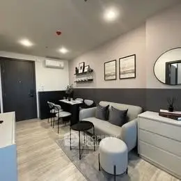 Modern living room with stylish decor and comfortable seating in a contemporary apartment.