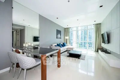 Luxurious modern living room with floor-to-ceiling windows and elegant decor in a high-rise apartment.