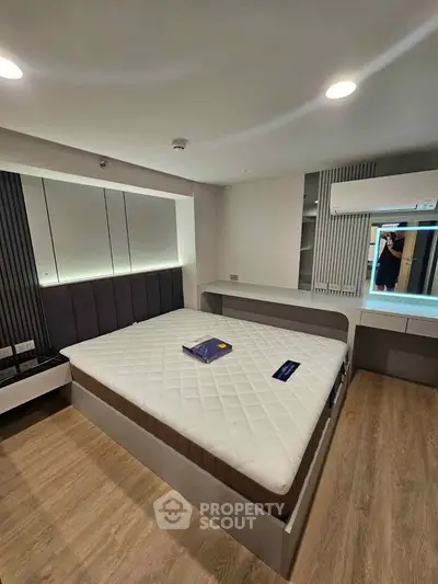 Modern bedroom with stylish decor and built-in storage solutions