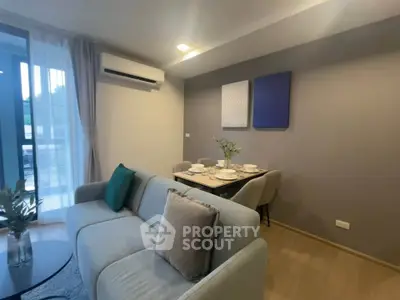 Modern living room with elegant dining area and stylish decor