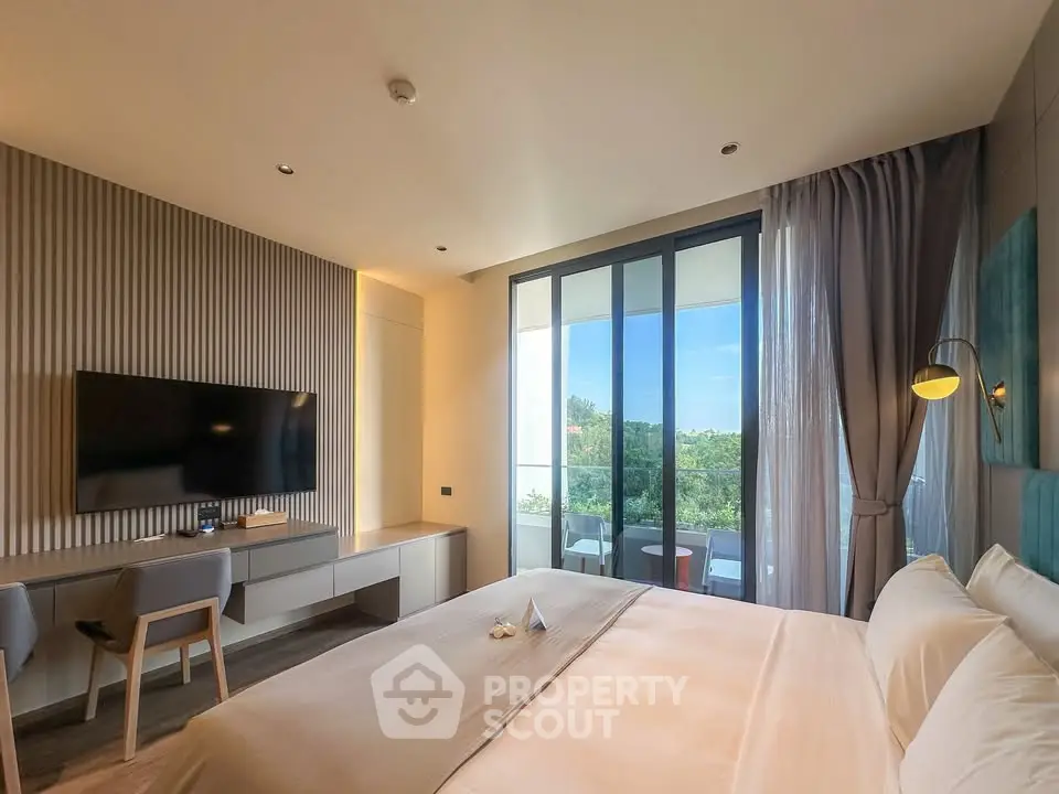 Luxurious bedroom with modern decor and stunning balcony view