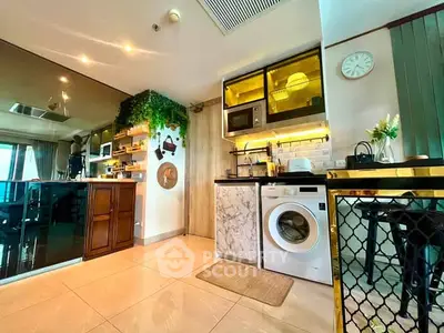 Modern kitchen with marble accents, washing machine, and stylish open shelving in a cozy apartment.