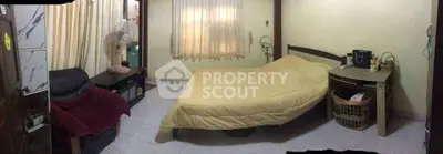 Cozy bedroom with a comfortable bed, fan, and organized storage space.