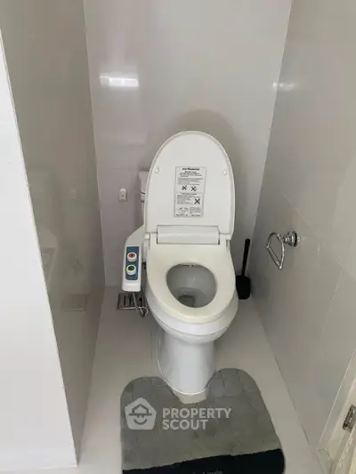 Modern bathroom with advanced toilet features sleek design and functionality.
