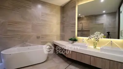 Luxurious modern bathroom with elegant bathtub and dual sinks
