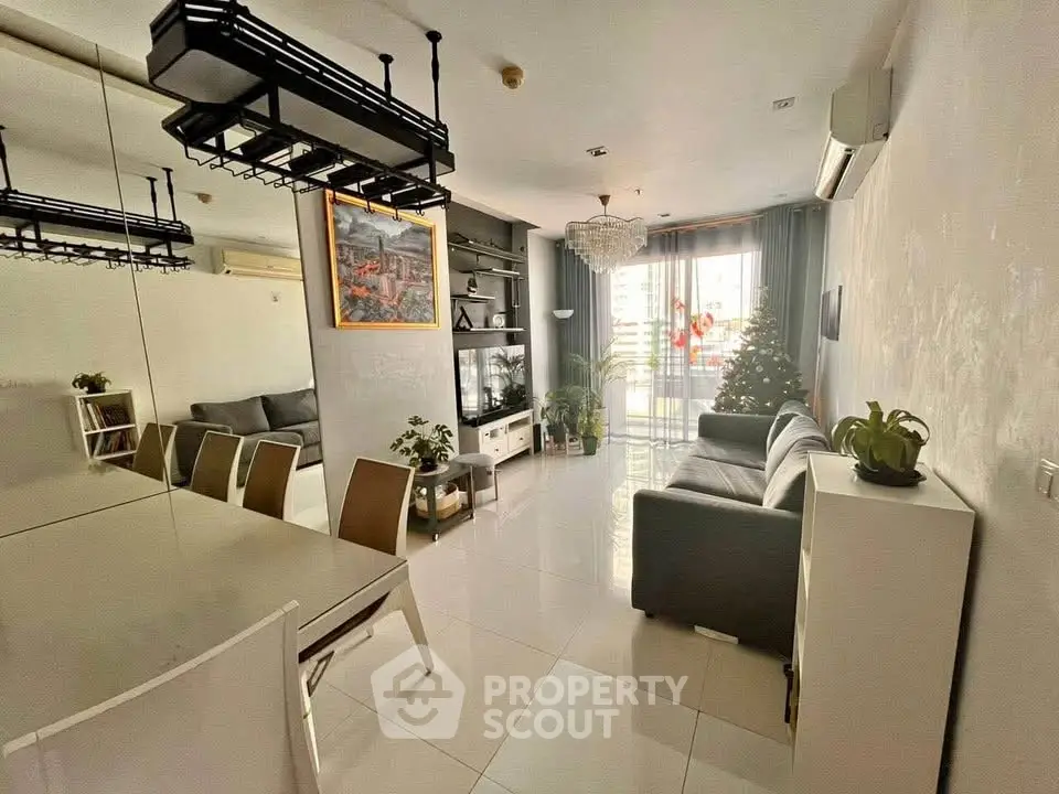 Spacious modern living room with elegant decor and large windows for natural light.