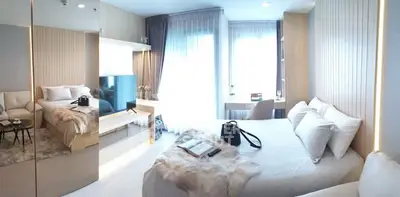 Luxurious modern bedroom with elegant decor and ample natural light