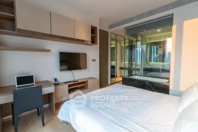 Modern bedroom with built-in desk and large window view