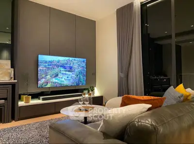 Modern living room with sleek TV setup and cozy seating area