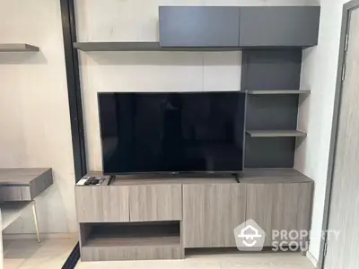 Modern living room with sleek TV unit and stylish shelving