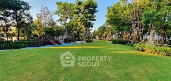 Spacious green garden with playground in a serene residential area