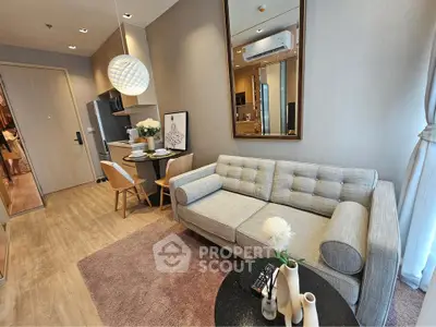 Modern living room with stylish decor, cozy sofa, and dining area in a contemporary apartment.