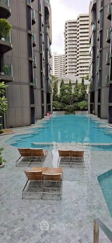 Luxurious residential pool area with modern architecture and serene ambiance.